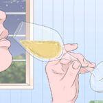 how to hold a champagne glass